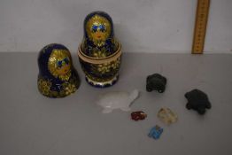 Mixed Lot: Small carved stone animals and a set of modern Russian dolls
