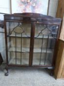 Edwardian mahogany bow front china display cabinet on ball and claw feet