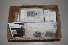 Box of various black and white photograps of steam and diesel trains