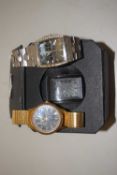 A group of three modern gents wristwatches