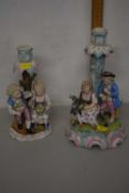 Two continental porcelain figural candlesticks