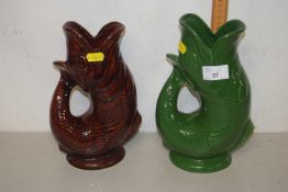 Two Dartmouth Pottery fish shaped gurgle jugs