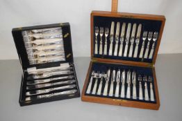Case of silver plate and mother of pearl handled dessert cutlery plus a further case of cutlery