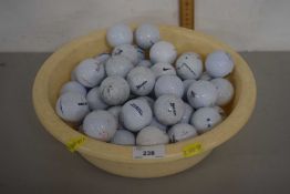 A bowl of golf balls