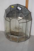 A glass mirror back terrarium