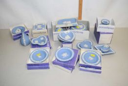 A collection of blue Wedgwood Jasper ware items in original boxes