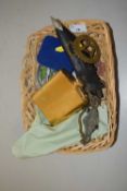 Basket of assorted items to include a small Kukri hip flask, horse brass etc