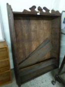 Late Victorian oak wall shelf with carved pediment