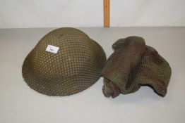 Vintage army helmet with mesh covering