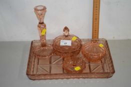A peach glass dressing table set