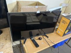 Sony flat screen TV and remote control