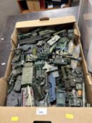 A box of assorted toy military vehicles