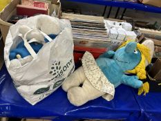 A large girls smurf and a qty of soft cuddly smurfs