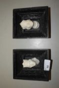 A pair of plaster work royalty heads set in black finish frames