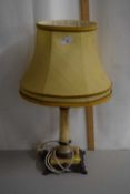 A table lamp with polished onyx base