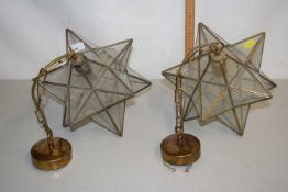 A pair of vintage star formed wall lights