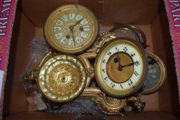 A box of various assorted clock movements and parts