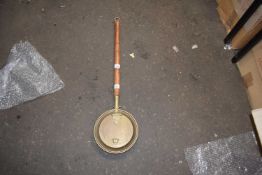 A small copper warming pan