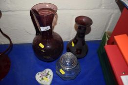 An aubergine glass jug, a Portmeirion heart shaped candle and two other glass ware