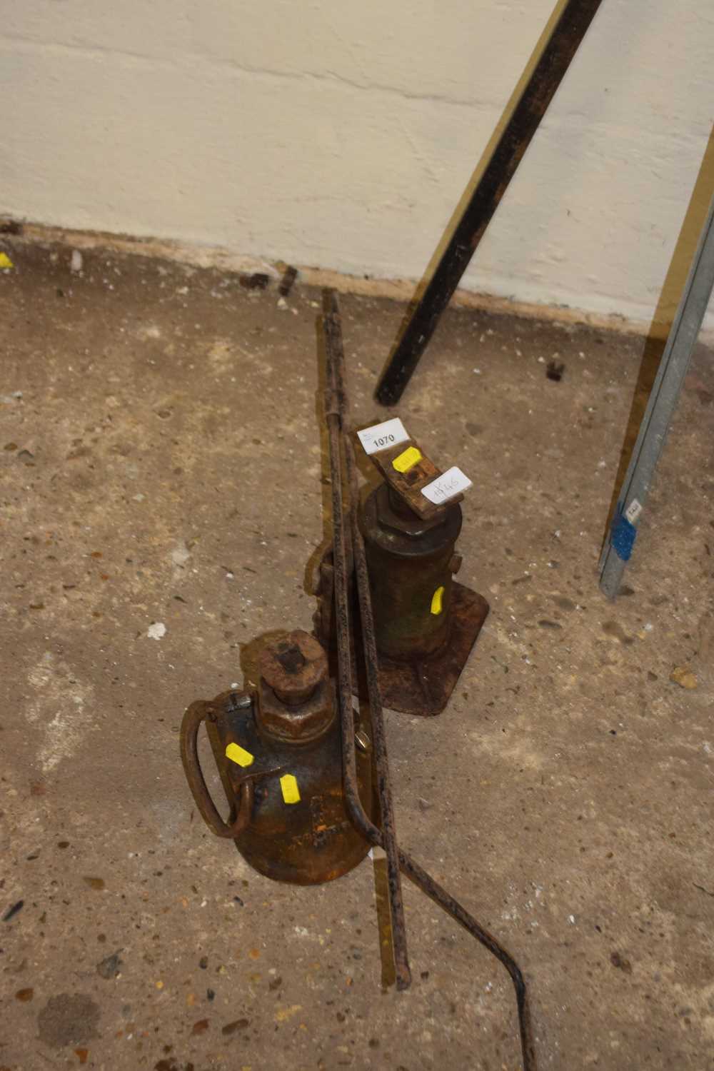 Two vintage bottle jacks
