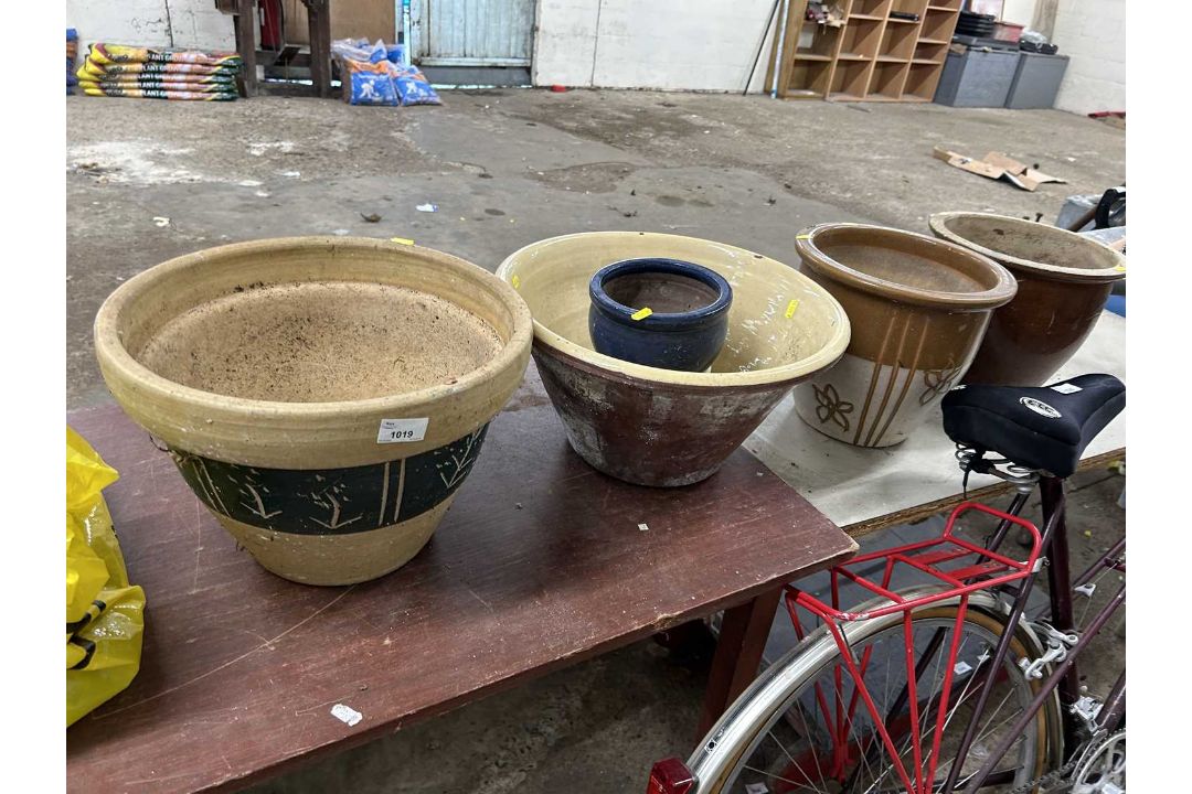 Mixed lot of various sized clay and terracotta plant pots