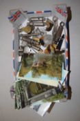 Box of assorted postcards, whistles and other items