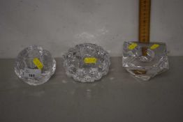 A group of three 20th Century clear Art Glass tea lights or candle holders, to include one Kosta