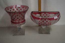 20th Century Bohemian cranberry and clear cut glass urn on square plinth base together with a