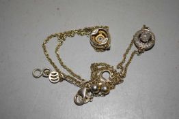 A pair of silver gilt diamond bracelets: both set with a diamond set disc to centre comprised of a