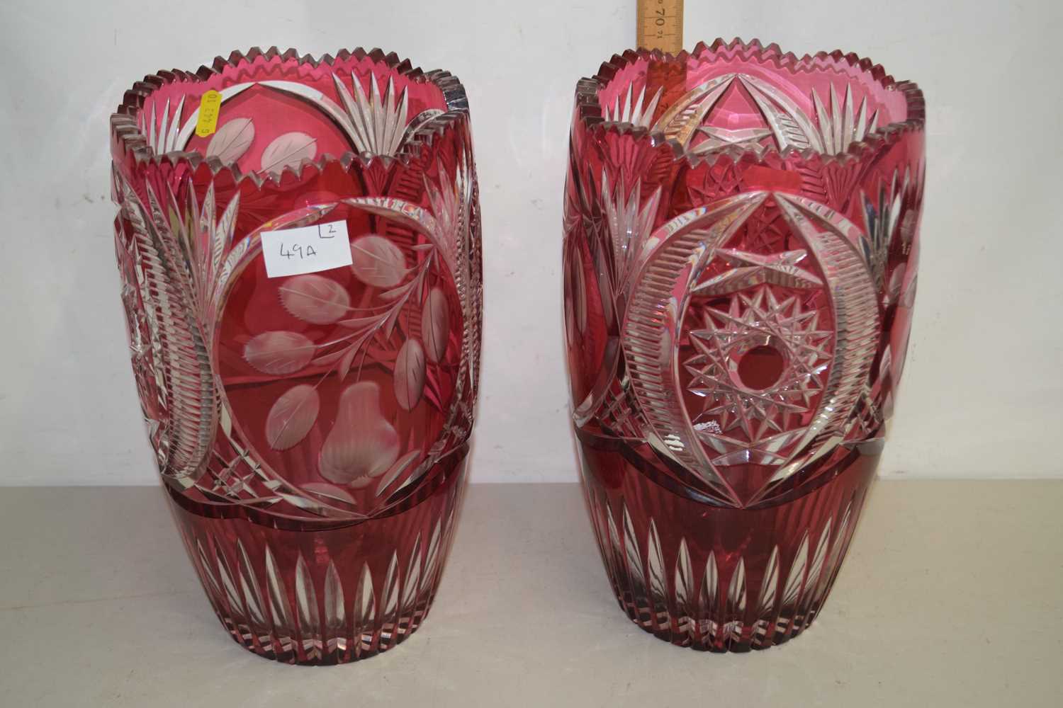 A pair of 20th Century Bohemian cranberry and clear cut glass vases of tapering form