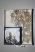 An unmarked filigree necklace, bracelet and earrings, (tests as silver), together with a pair of