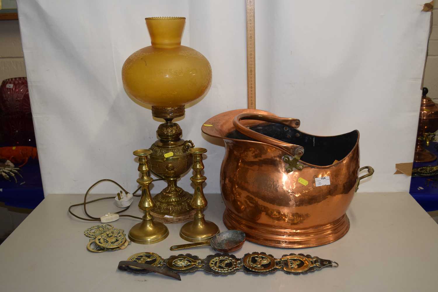 Mixed Lot: Copper coal bucket, horse brasses, brass based table lamp and a pair of candlesticks
