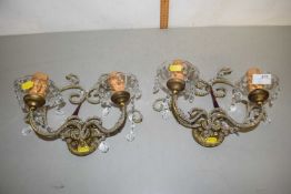 A pair of two light wall sconces with crystal glass decoration