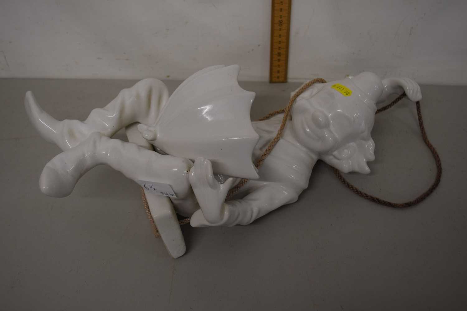 A porcelain model hanging clown