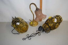 A pair of glass and metal framed ceiling light fittings together with a further desk lamp