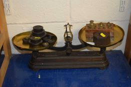 A large Victorian scale with a quantity of weights