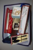 Box of various assorted costume jewellery, travel clock etc