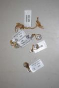 Four silver gilt aquamarine and diamond highlight pendants and one chain: the pear shape frame set