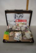 A case containing various mainly loose world stamps