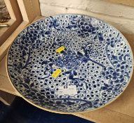 A Japanese blue and white decorated dish with abstract floral design