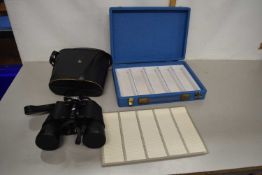 Boxed pair of binoculars together with an empty box with slots for film slides