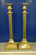 Two large candlesticks supported with Corinthian columns