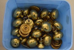Small box containing a quantity of brass door knobs