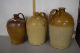 Group of three stone ware flagons, two with light brown bodies one with dark brown