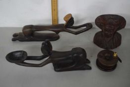 Box containing various wooden ornaments and a wooden fishing reel