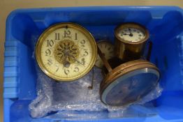 A plastic box containing a quantity of watches and watch spares