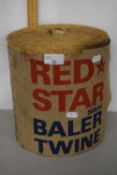 A large Red Star baler twine with paper label