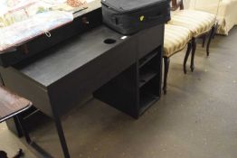 An Ikea black desk and over shelf unit