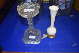A cut glass candlestick together with small white vase with base