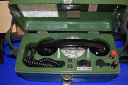 Military field telephone 704B in green case with carrying strap and clear dial